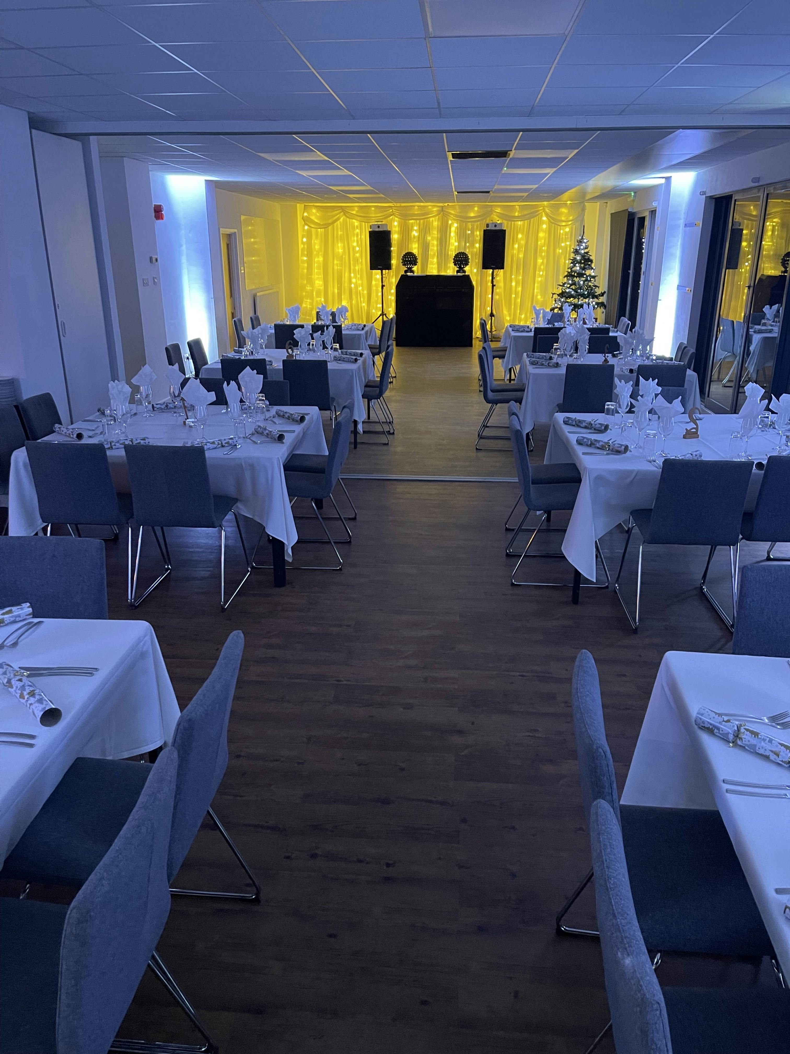 Elegant Waterside Suite set for formal dinner, perfect for corporate events and weddings.