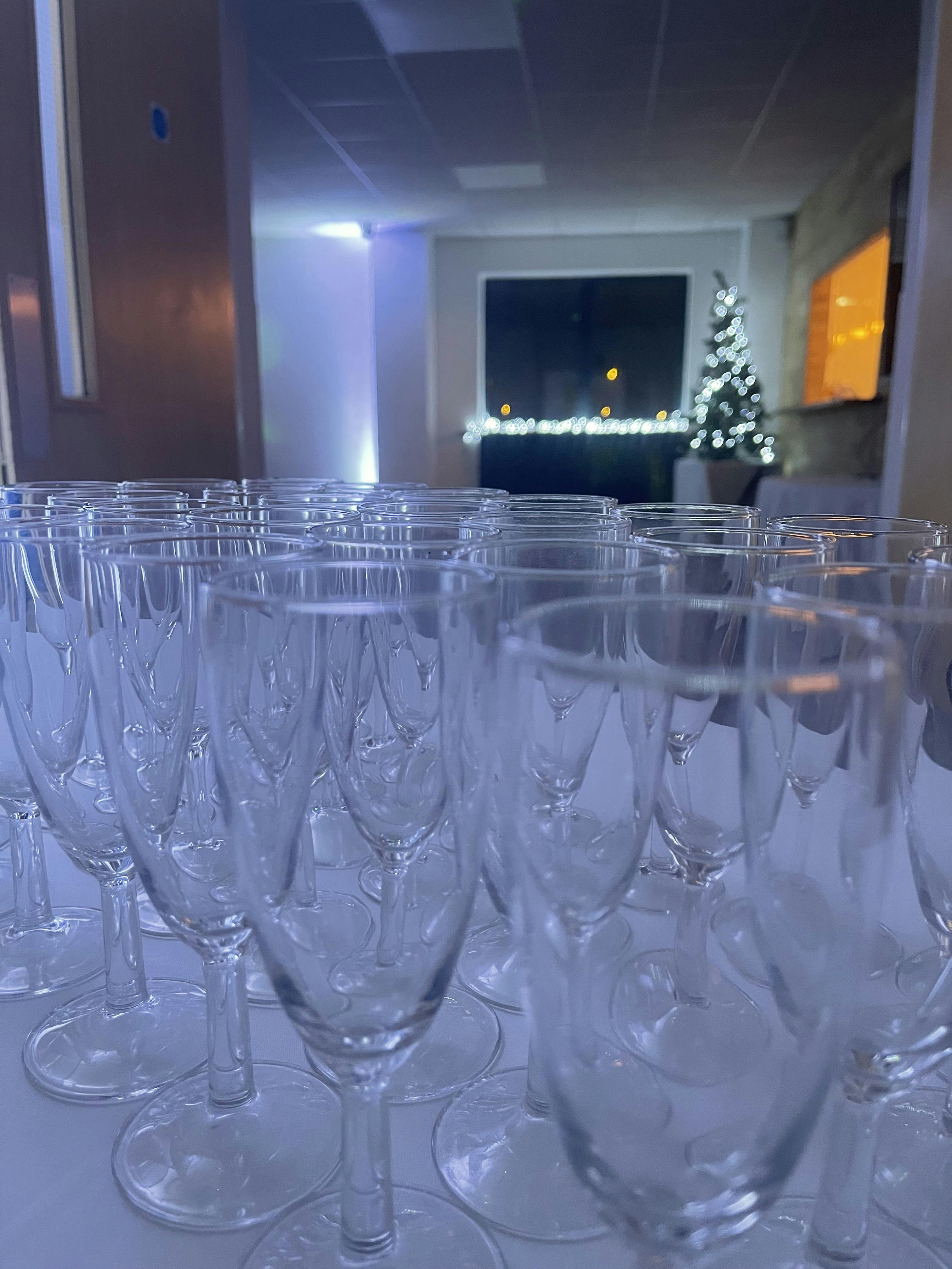 Elegant Waterside Suite with clear glasses, perfect for networking events and celebrations.