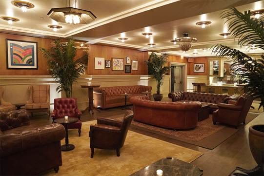 Castelli Room at Soho Grand Hotel: elegant lounge with plush seating for networking events.