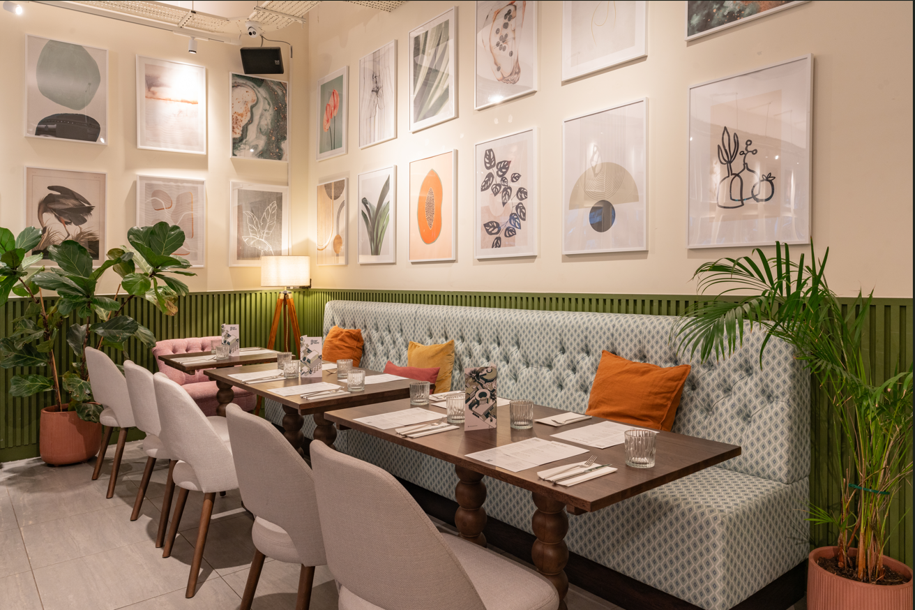 Stylish semi-private dining area in Dear Grace for intimate meetings and events. - Banner