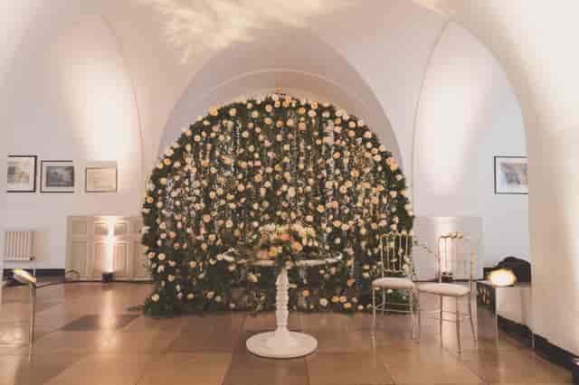 Elegant floral backdrop in Banqueting House for weddings and upscale events.