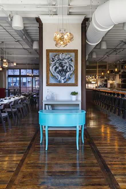 Private Dining Room in SRV Boston with lion painting, perfect for events and gatherings.