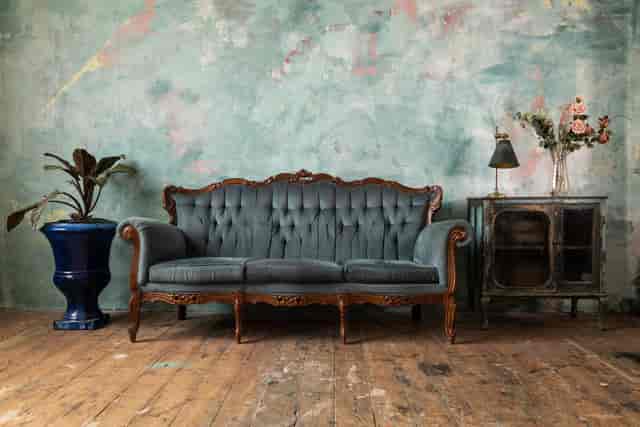 Bohemian lounge setup with tufted sofa for stylish event networking and relaxation.