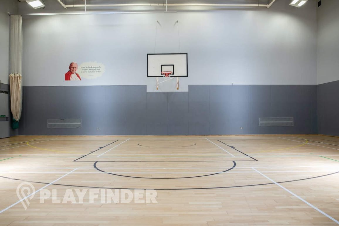 Indoor sports hall at St Aloysius' College with a basketball court for events.