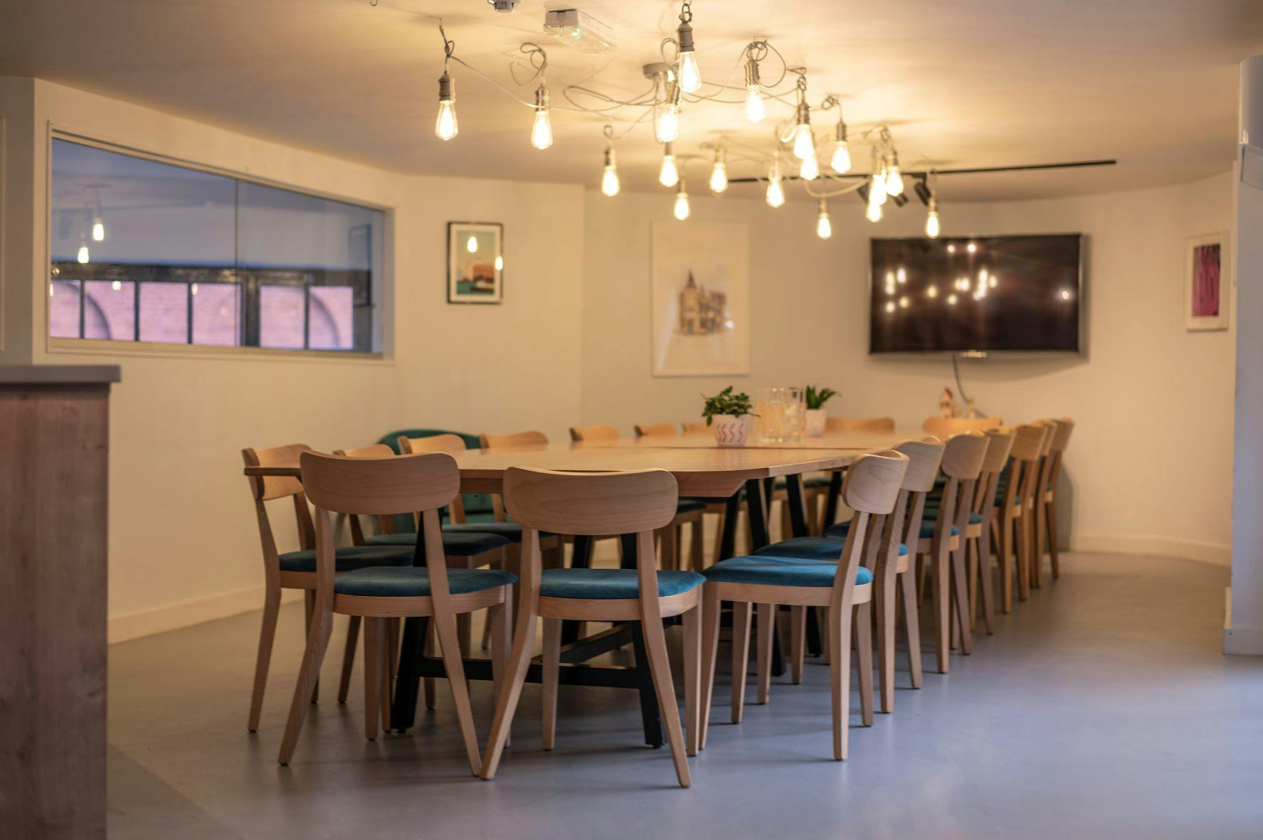 Events Space in MerseyMade: bright meeting room with wooden table, ideal for workshops.