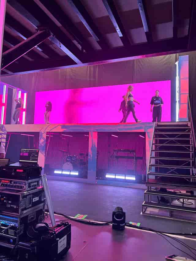 Sugar Studios tiered stage with LED backdrop for live event production and musical performances.