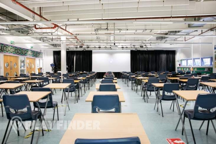 Main Hall at St Aloysius' College, spacious conference room with tables for meetings.