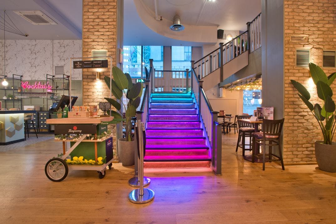 Mezzanine at Slug & Lettuce, St. Pauls: stylish staircase, vibrant event space for gatherings.