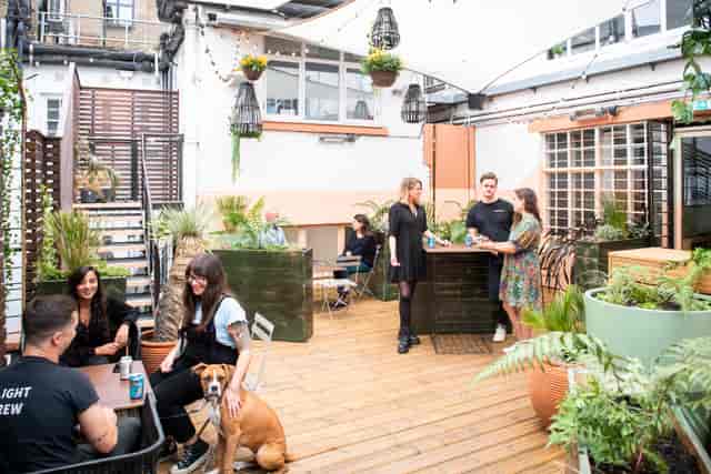 Vibrant outdoor terrace at Runway East Soho, perfect for casual meetings and networking events.