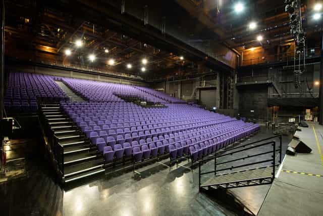 Troubadour Wembley Park Theatre auditorium with vibrant purple chairs for events.