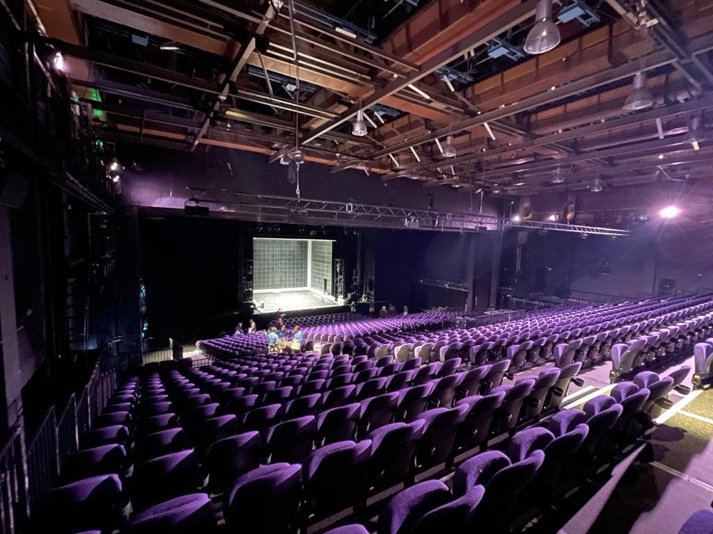 Troubadour Wembley Park Theatre auditorium with plush purple seating for events.