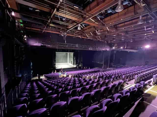Troubadour Wembley Park Theatre auditorium with plush purple seating for events.