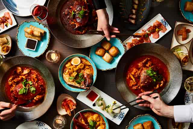 Vibrant dishes in Katong Private Dining Room for culinary events and social gatherings.
