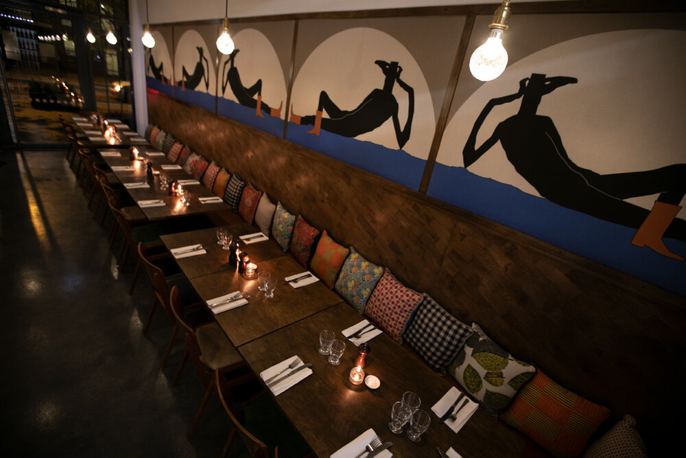 Stylish Lardo restaurant dining space with elegant table, ideal for corporate dinners and gatherings. - Banner