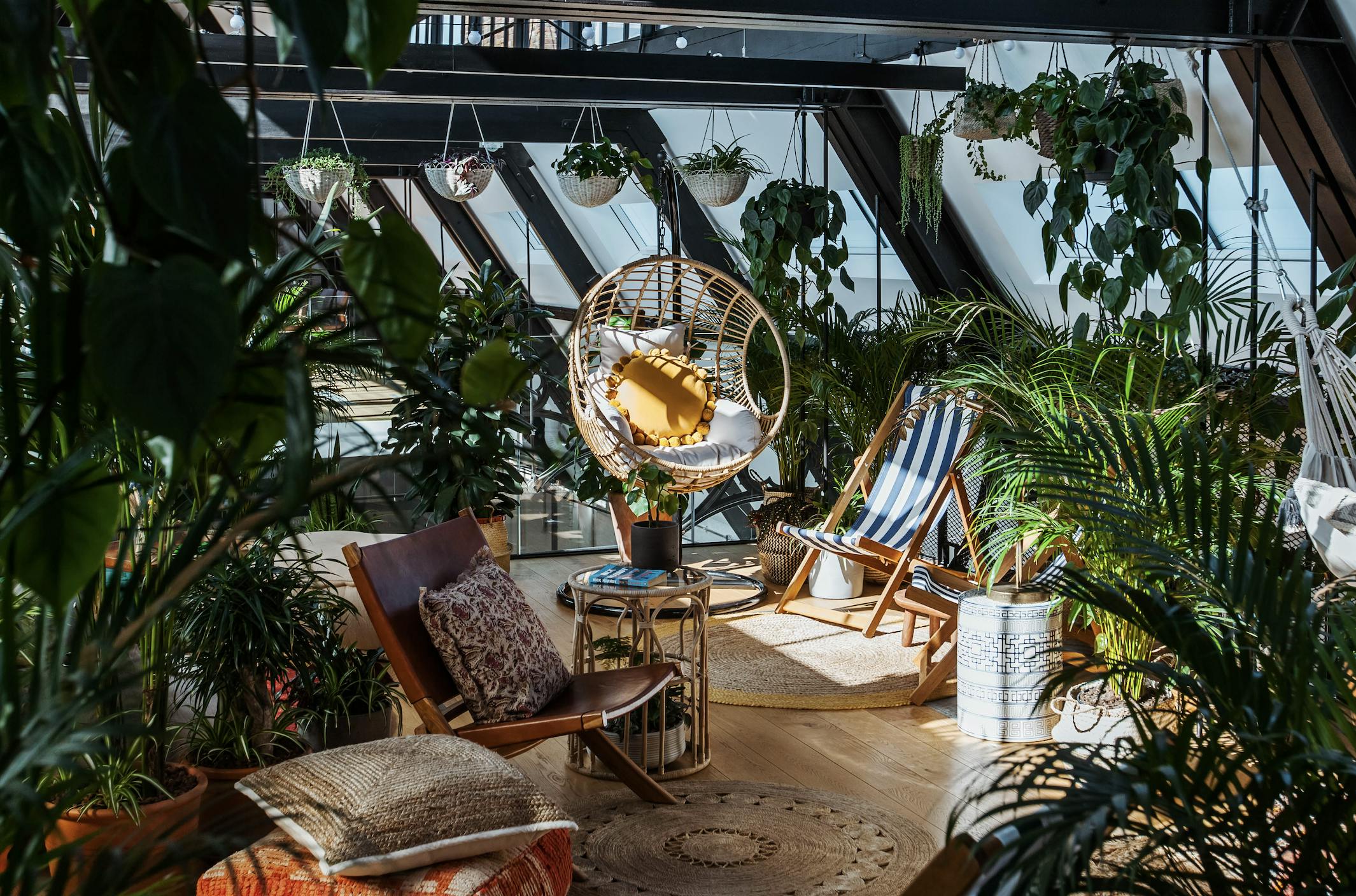 Hanging Garden lounge with greenery, ideal for networking events and informal meetings.