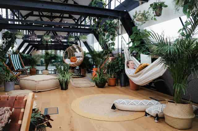 Hanging Garden in Missionworks: vibrant plant-filled space for creative gatherings and relaxation.