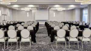 Chesapeake Ballroom: elegant meeting space with black tables, ideal for conferences and workshops.