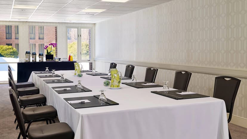Meeting room at Delta by Marriott, featuring a long table for corporate events.