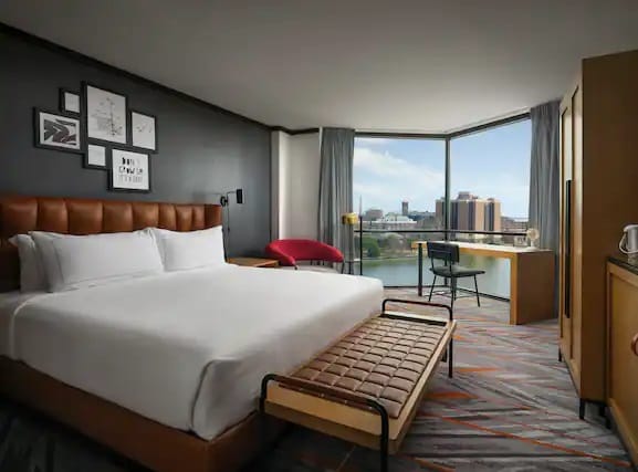 Modern hotel room with king-sized bed at Dockside, ideal for business travelers.