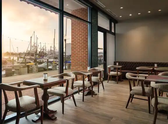 Stylish waterfront venue with large windows for corporate meetings and gatherings.