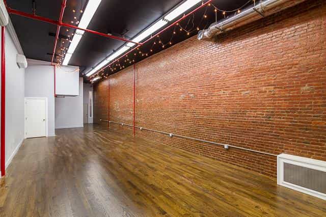 Luxurious Tribeca loft with exposed brick, ideal for events and workshops.