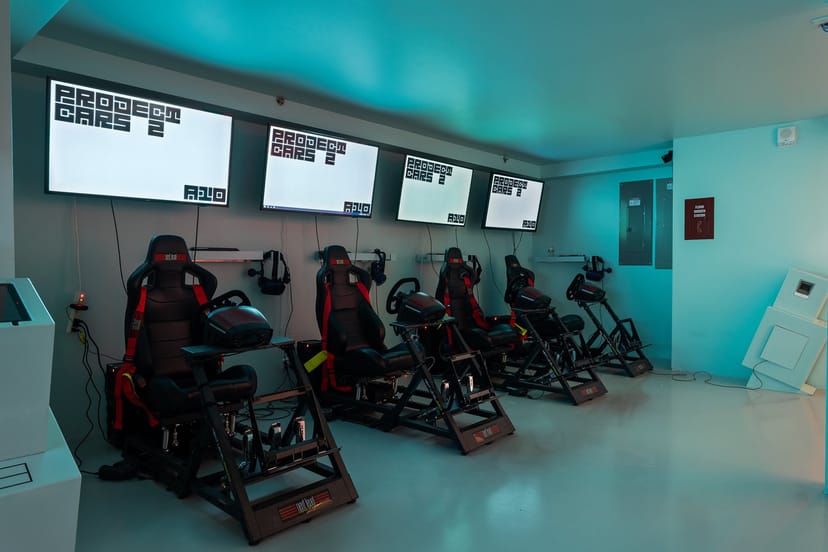 Modern gaming setup with racing simulators for team-building events in VR World NYC.