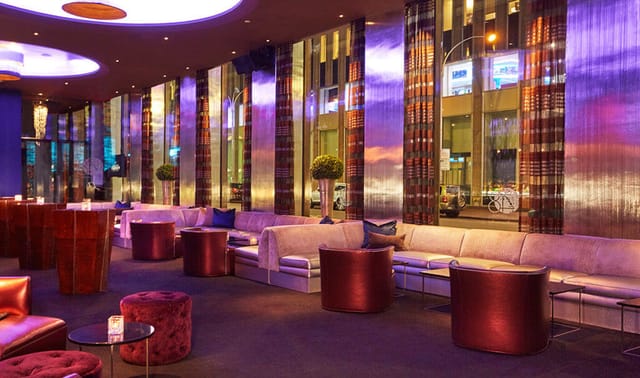 Semi-private VIP room at 48 Lounge with plush seating, ideal for cocktail receptions.