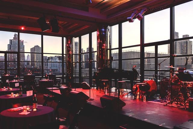 Stylish event space with skyline views, perfect for performances and celebrations.