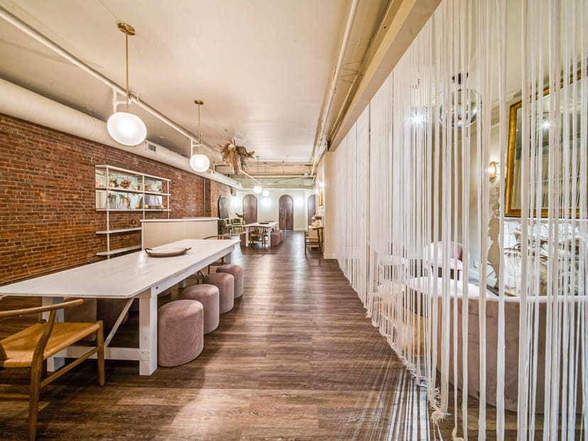 Stylish event space with brick walls, ideal for workshops and networking events.