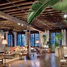 Stylish Loft Story event space with wooden beams, ideal for networking and gatherings.