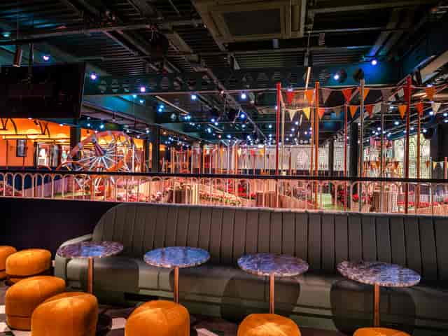 Vibrant carnival-themed event space at The Fairground Bar, ideal for corporate gatherings.