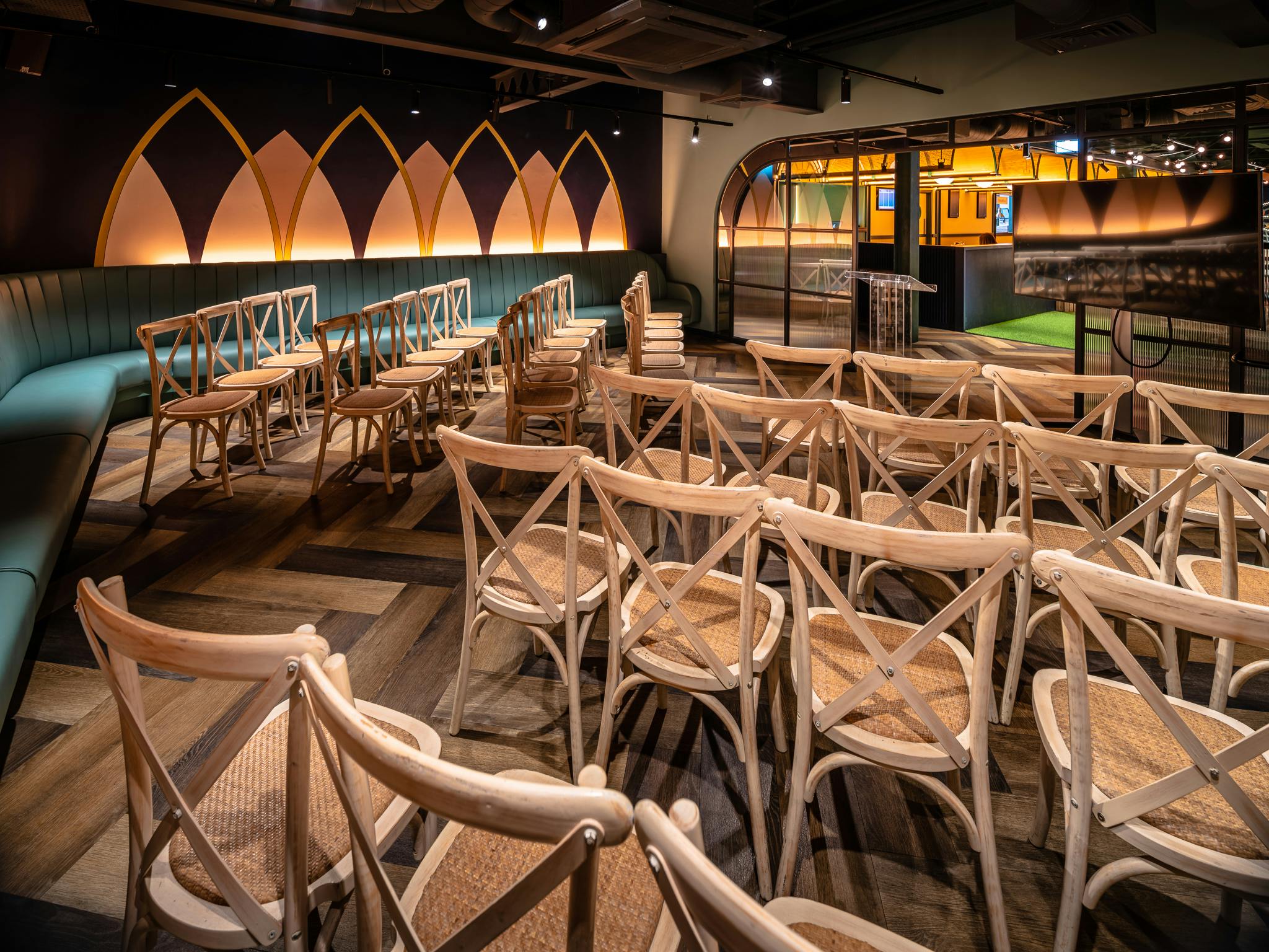 The Boathouse event space with stylish wooden chairs for presentations and workshops.