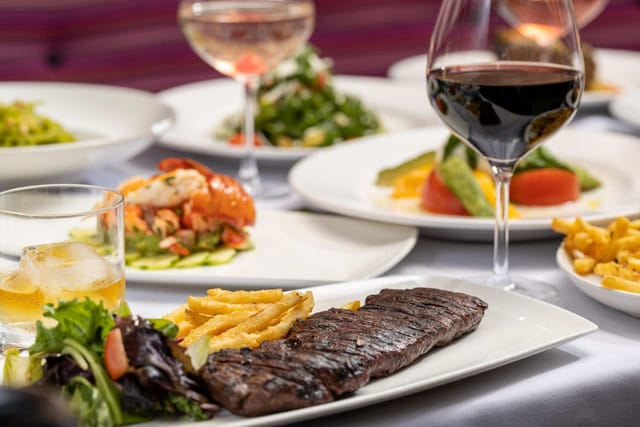 Elegant dining table with gourmet dishes at Arte Cafe for corporate dinners and events.