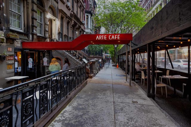Vibrant outdoor dining at Arte Cafe, perfect for casual meetings and networking events.