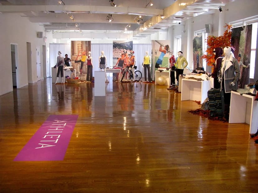 Open-air terrace event space with mannequins showcasing athletic apparel in Midtown.