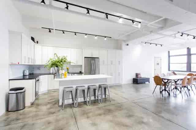 Modern kitchen and dining area in Meaux Space for networking events and meetings.