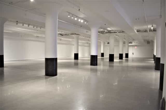 Spacious Clinton Mercantile venue with high ceilings for events and exhibitions.