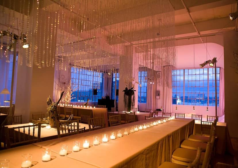 Elegant event space with candlelight, ideal for weddings and corporate events.