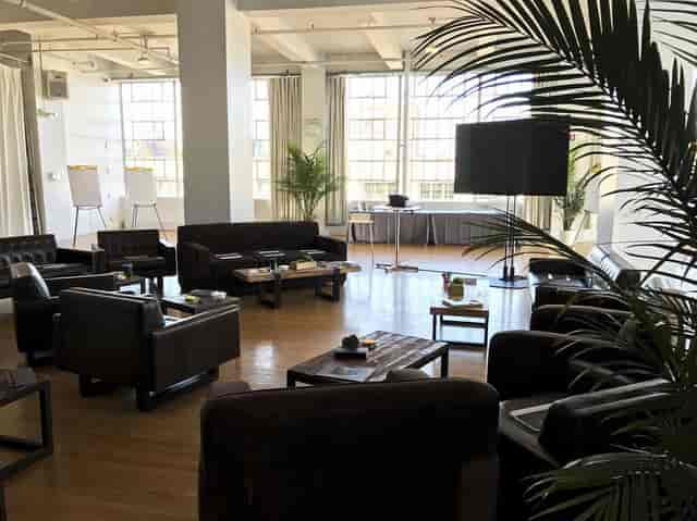 Spacious meeting room with natural light for creative events at Sun West Studios.