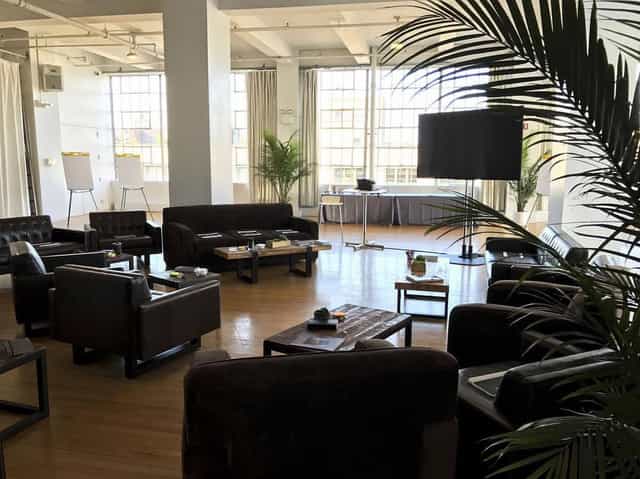 Spacious meeting room with natural light for creative events at Sun West Studios.