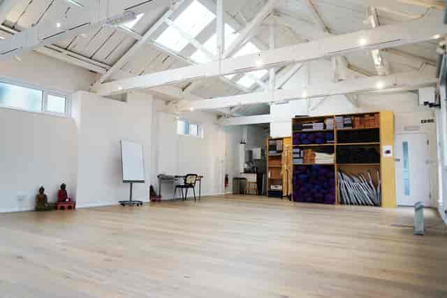 Yogacampus Finsbury Park: minimalist venue with vaulted ceilings for wellness workshops and events.