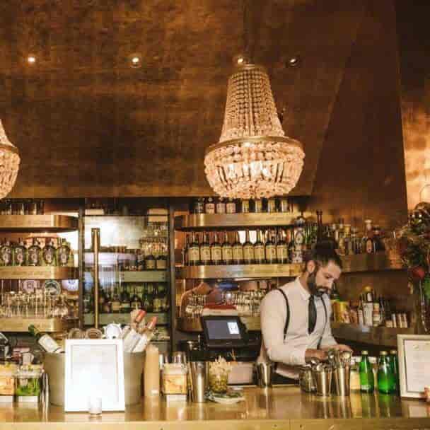 Stylish bar setup with chandeliers for upscale private events in Goldbar.