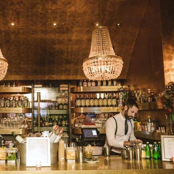 Stylish bar setup with chandeliers for upscale private events in Goldbar.