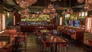 Stylish venue with warm lighting, perfect for intimate gatherings and networking events.