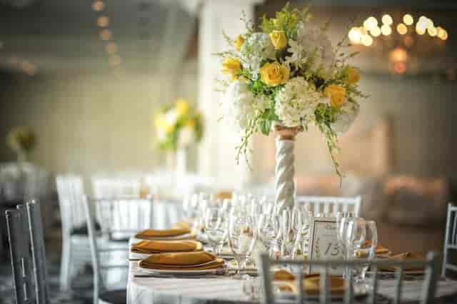 Elegant banquet table with floral centerpiece at Grand Oaks Country Club event.