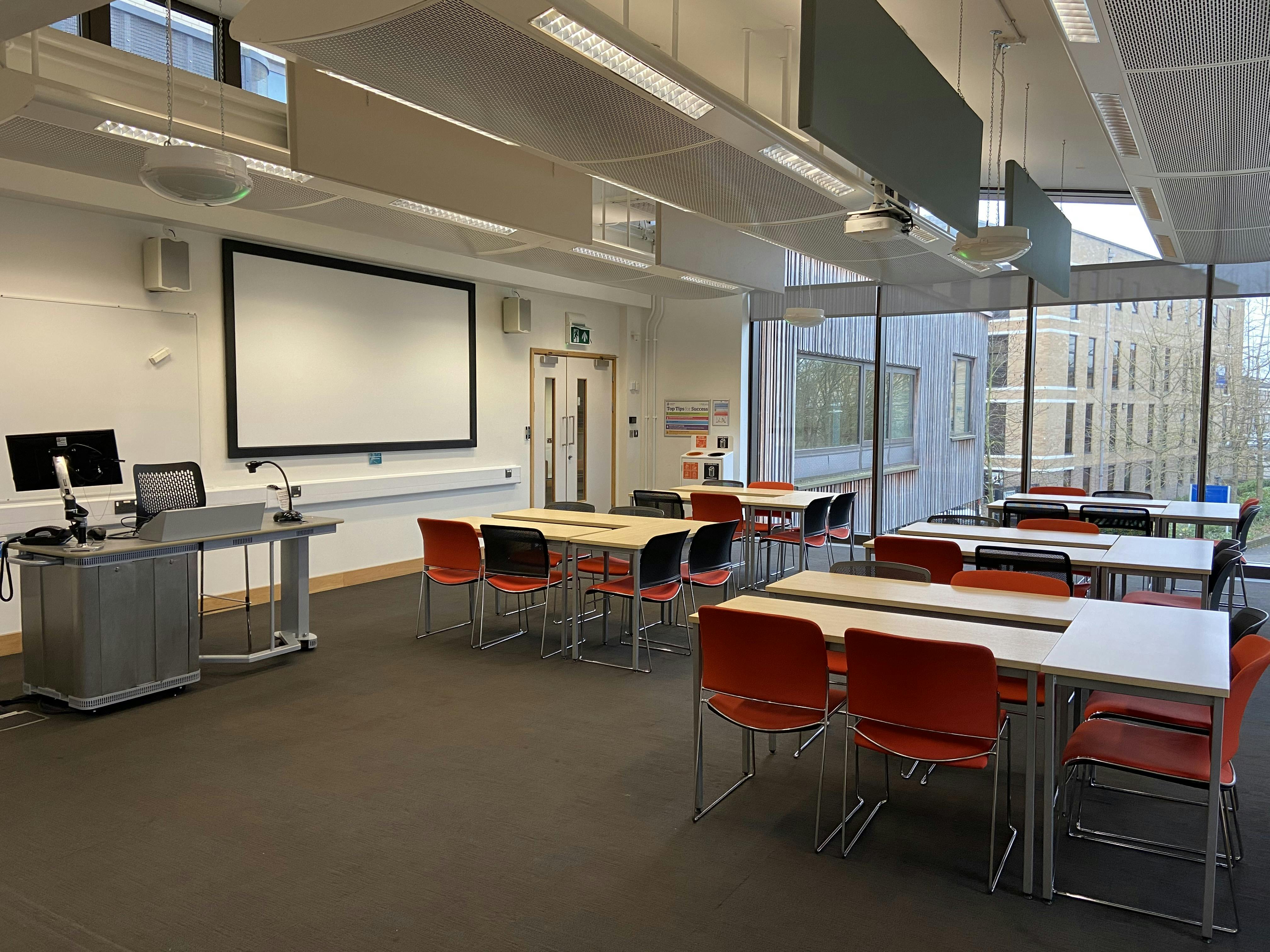 Modern medium classroom with natural light, ideal for workshops and meetings at ARU Venue Hire.