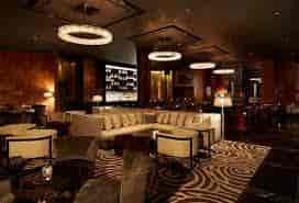Sophisticated Ascent Lounge with plush seating, ideal for networking events and cocktail receptions.