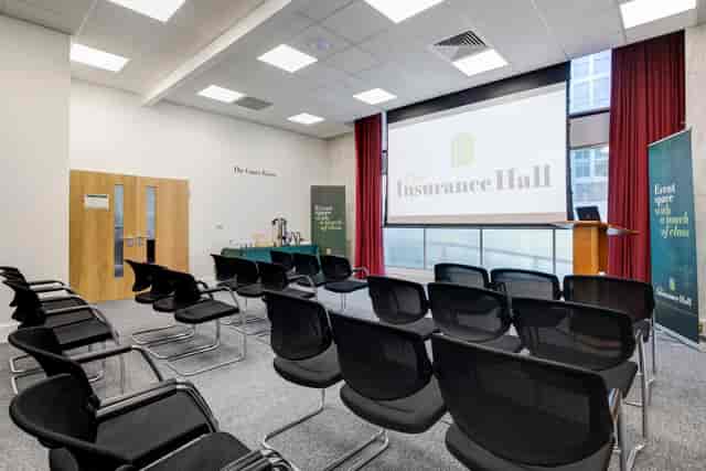 The Court Room in The Insurance Hall, featuring a large screen for conferences.