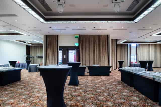 Royal Suite event space in Millennium Gloucester, elegant setup for networking and receptions.