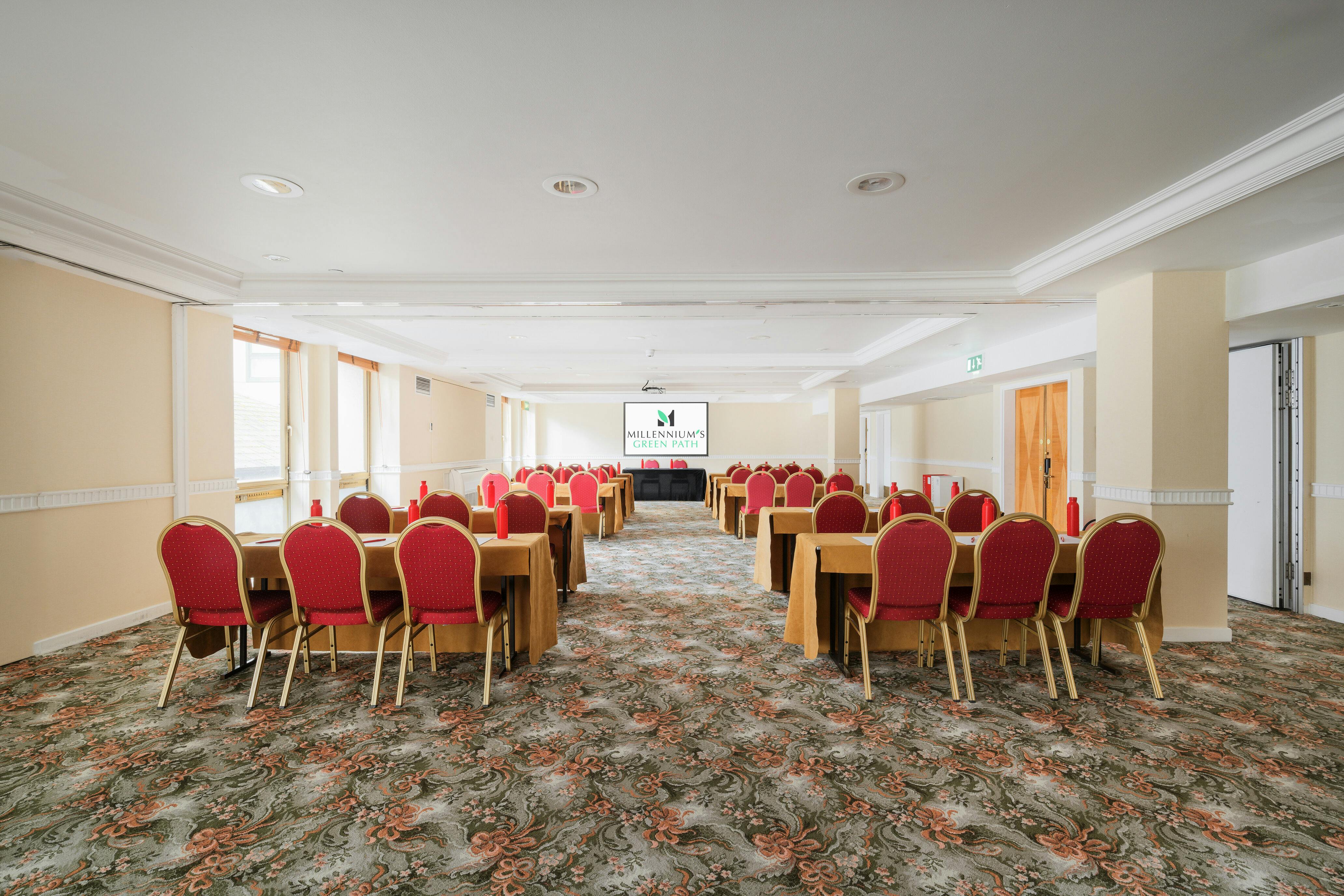 Kensington Suite meeting space with red chairs, ideal for corporate events and workshops.